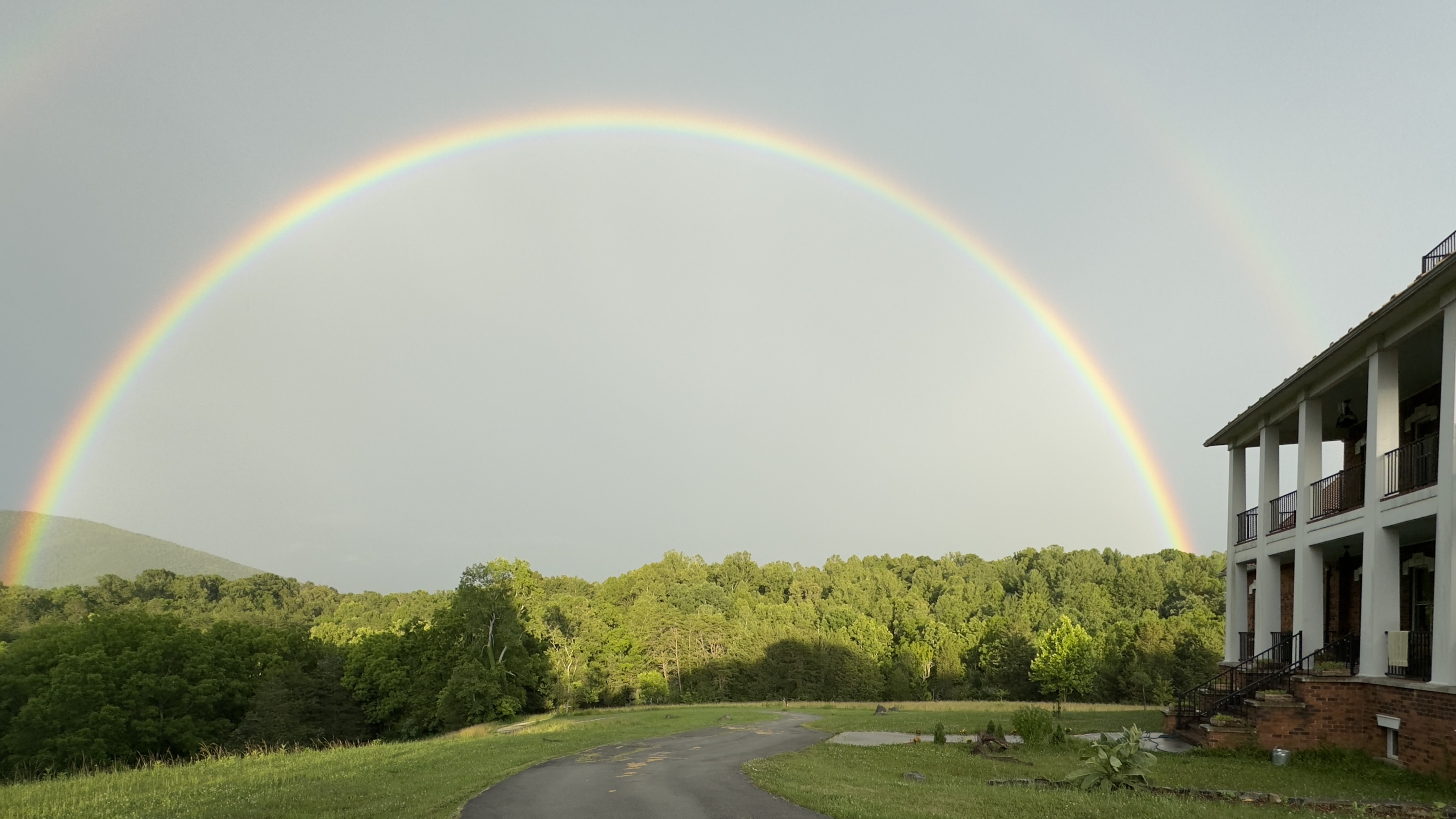 Rainbow over mountain landscape viewed from Arroway Manor